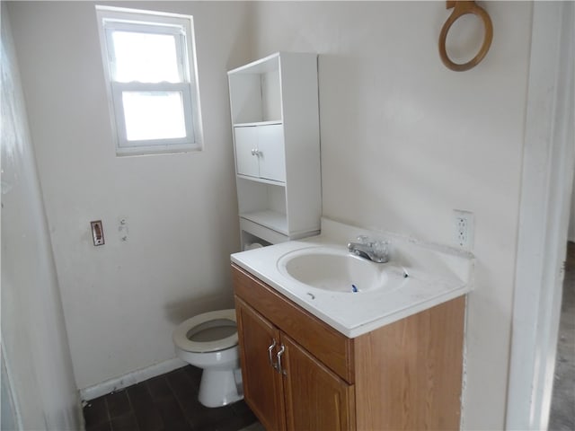 bathroom featuring vanity and toilet