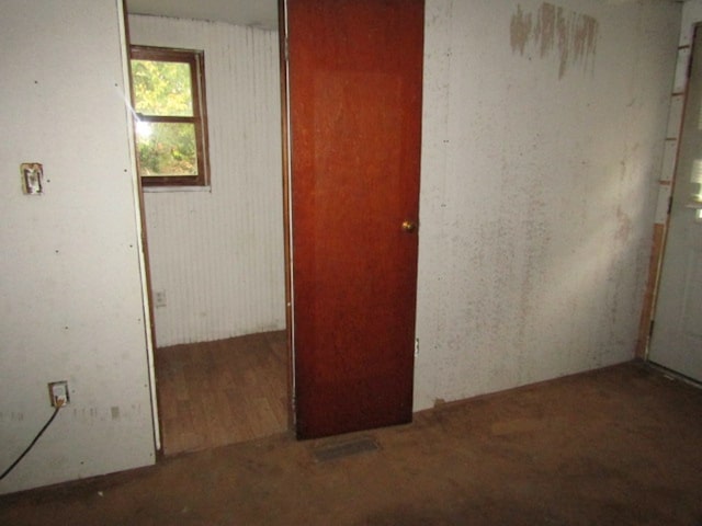 empty room with hardwood / wood-style flooring