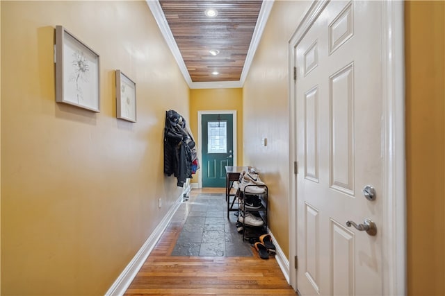 hall with hardwood / wood-style floors, wooden ceiling, and ornamental molding