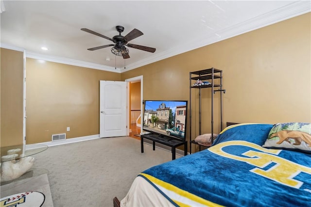 bedroom featuring ornamental molding, carpet flooring, visible vents, and baseboards