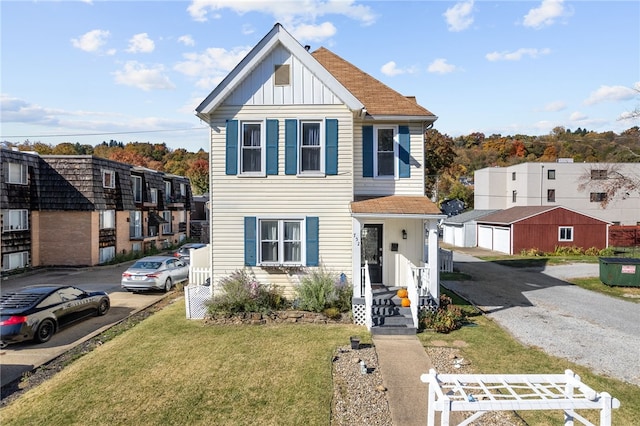 view of front of home with a front yard and a garage