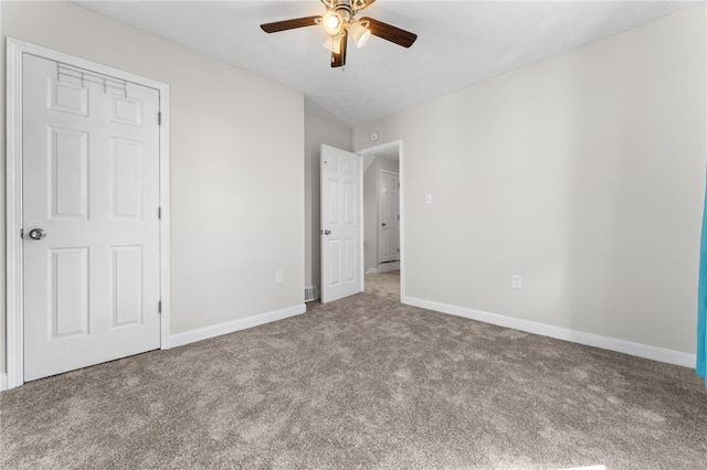 unfurnished bedroom with a closet, carpet floors, and ceiling fan