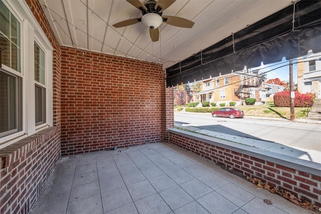 view of patio featuring ceiling fan