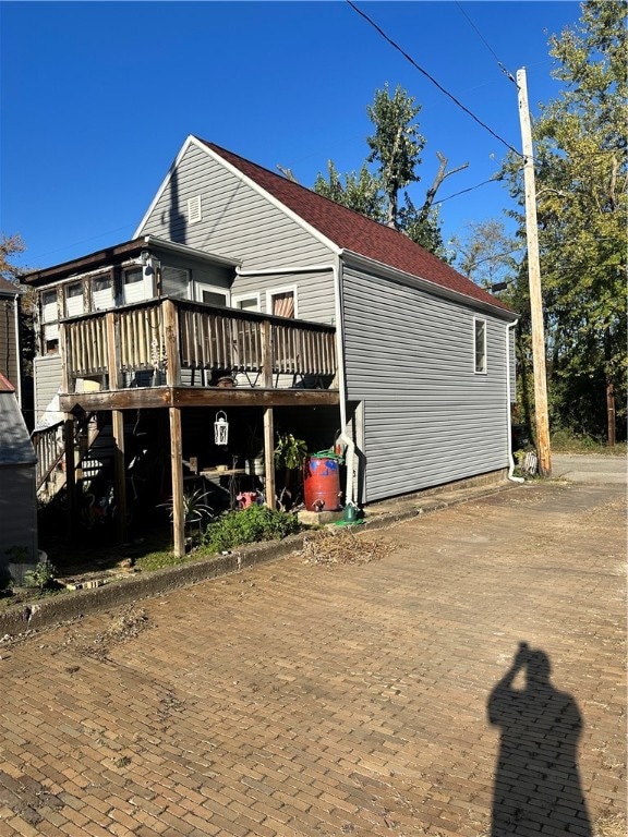 exterior space featuring a wooden deck