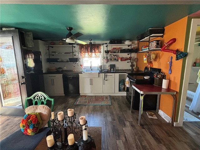 kitchen featuring sink, black appliances, dark hardwood / wood-style flooring, white cabinetry, and ceiling fan