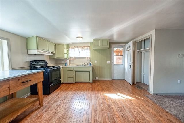 kitchen with sink, light hardwood / wood-style floors, black electric range oven, and green cabinetry