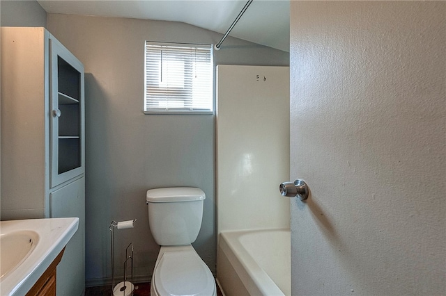 full bathroom with toilet, vanity, shower / bathing tub combination, and lofted ceiling