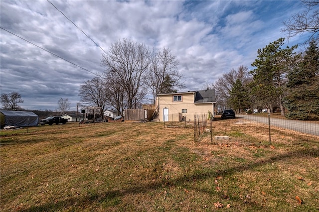 view of side of home with a lawn