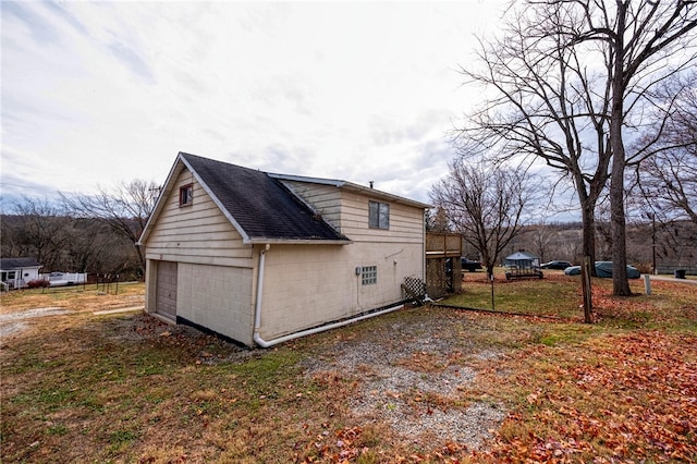 view of side of property with a garage