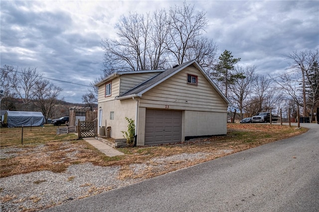 view of property exterior with a garage