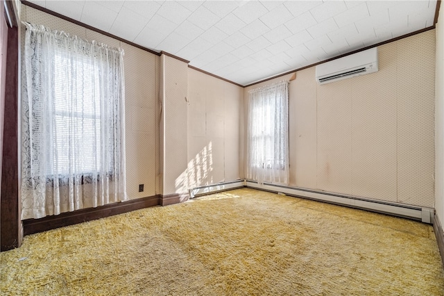 spare room with a wall unit AC, carpet floors, and crown molding