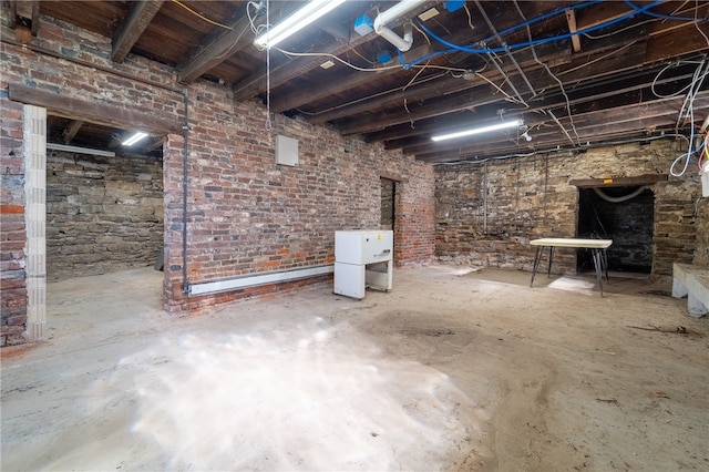 basement with brick wall