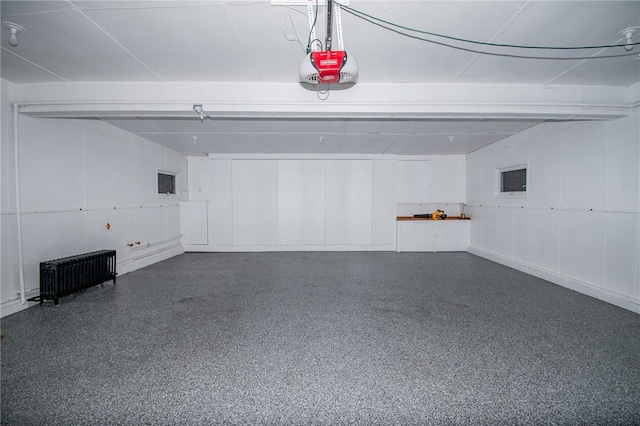 132 Random Rd, Corry, PA 16407 - garage featuring radiator heating unit and a garage door opener