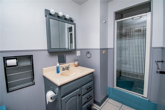 132 Random Rd, Corry, PA 16407 - bathroom featuring vanity, bath / shower combo with glass door, tile patterned floors, and a wainscoted wall