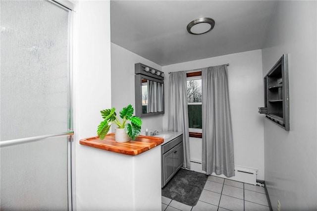 132 Random Rd, Corry, PA 16407 - bathroom featuring tile patterned floors, vanity, and a baseboard radiator