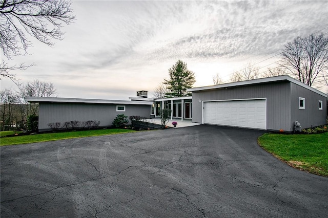 132 Random Rd, Corry, PA 16407 - mid-century inspired home with an attached garage and driveway