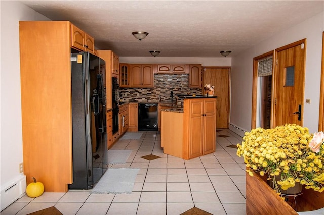 132 Random Rd, Corry, PA 16407 - kitchen with black appliances, dark countertops, decorative backsplash, and light tile patterned floors