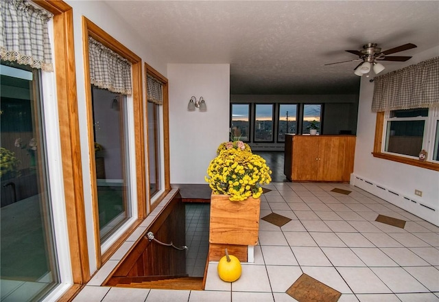 132 Random Rd, Corry, PA 16407 - sunroom with tile patterned flooring and baseboard heating