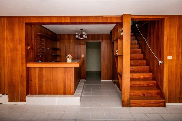 132 Random Rd, Corry, PA 16407 - welcome area with wood walls, stairway, and a chandelier