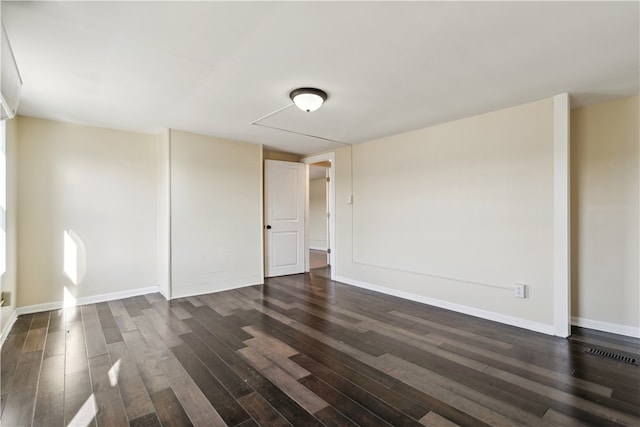 unfurnished room featuring dark hardwood / wood-style flooring