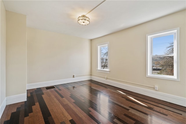 spare room with wood-type flooring