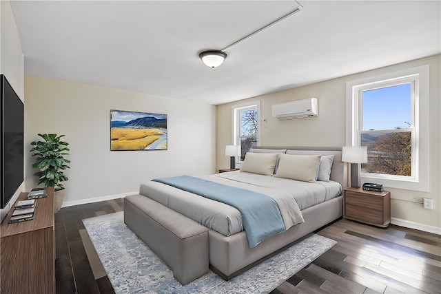 bedroom with a wall mounted air conditioner, dark hardwood / wood-style floors, and multiple windows