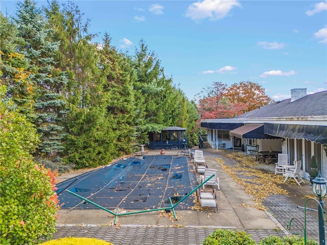 view of swimming pool featuring a gazebo