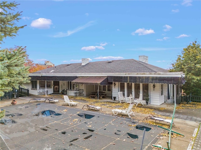 795 E Beau St, South Strabane, PA 15301 - back of house with a patio, a chimney, and a covered pool