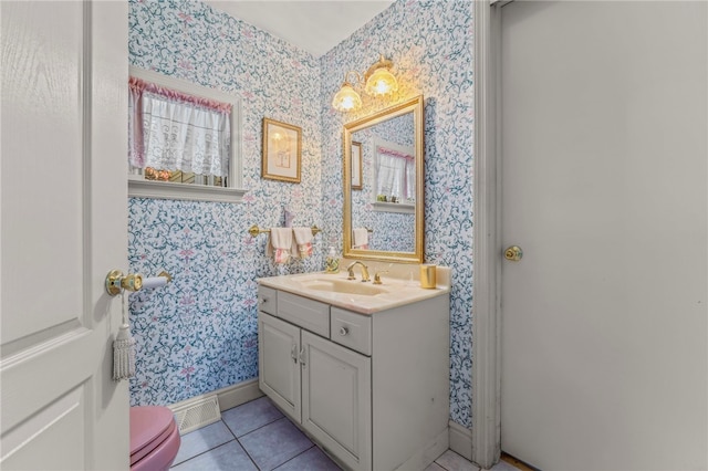 bathroom featuring vanity, toilet, and tile patterned flooring