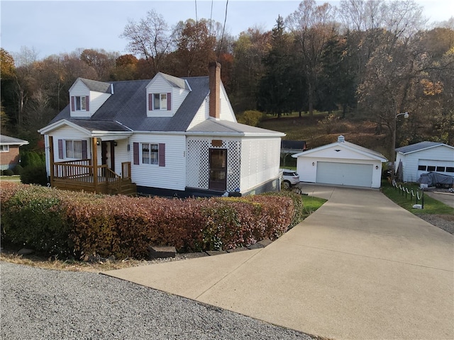 view of front of home with a porch, an outbuilding, and a garage