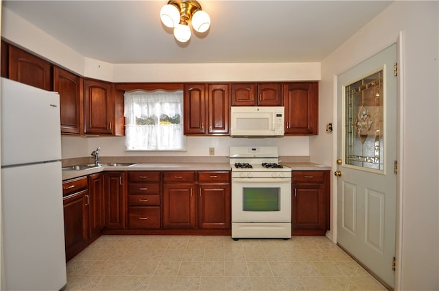 kitchen with sink and white appliances