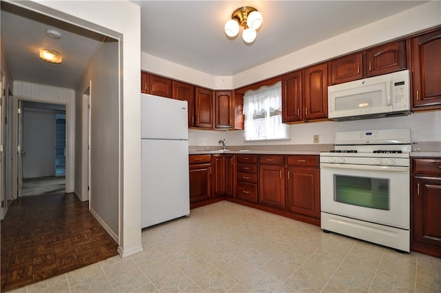 kitchen with sink and white appliances