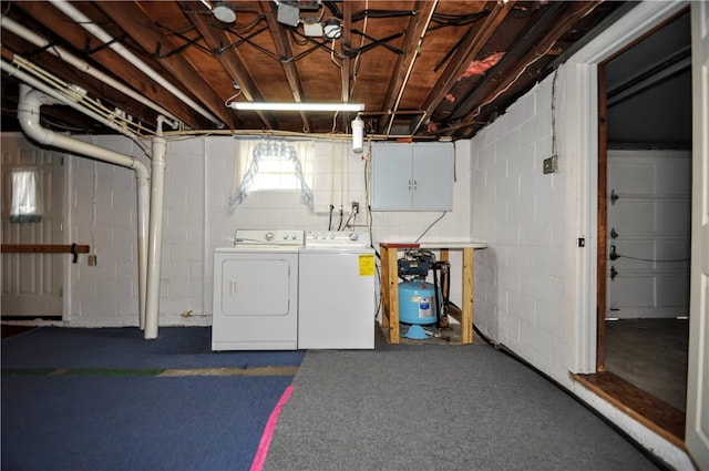 basement with separate washer and dryer and dark colored carpet