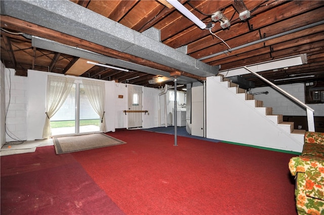 basement with washer / dryer and carpet floors