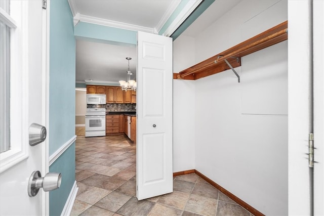 walk in closet with a notable chandelier