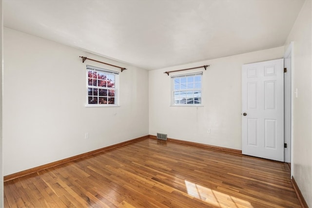 empty room with wood-type flooring