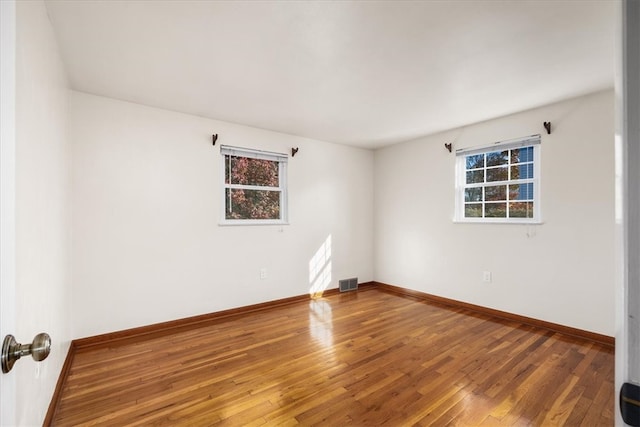 empty room featuring hardwood / wood-style floors