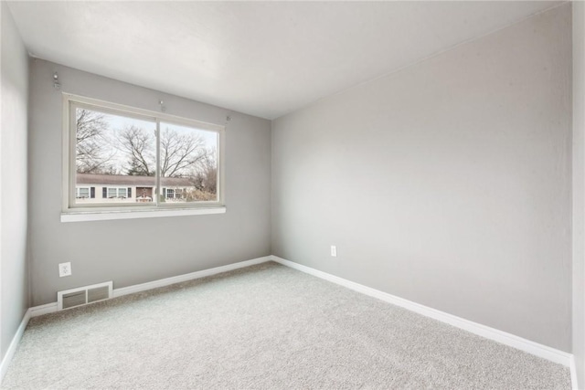 unfurnished room featuring carpet