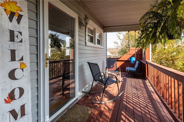 wooden terrace featuring a porch