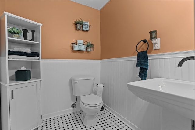 bathroom featuring sink and toilet