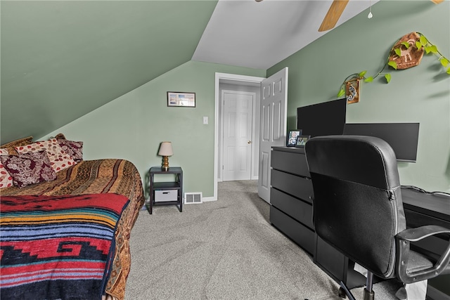 bedroom featuring vaulted ceiling, light colored carpet, and ceiling fan