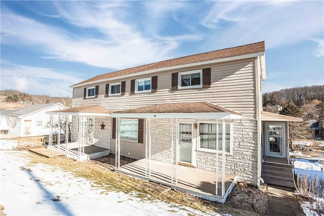 79-81 Lower Clinton St, Canoe/Banks Twps, PA 15772 - view of front of house featuring stone siding, a deck, and a patio