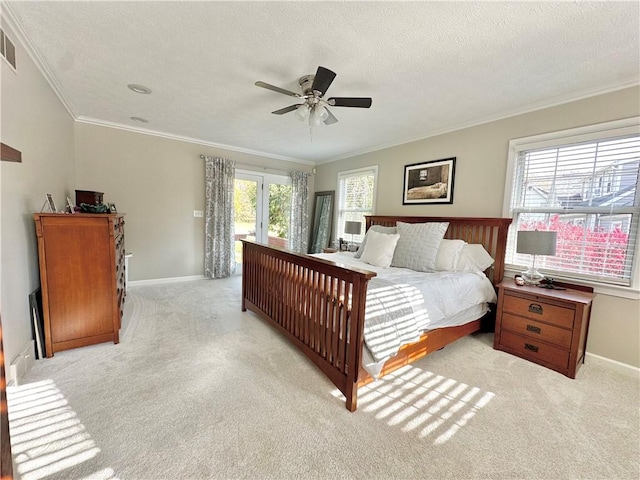 bedroom featuring crown molding, light carpet, and access to outside