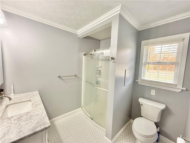 bathroom with crown molding, vanity, a textured ceiling, a shower with shower door, and toilet