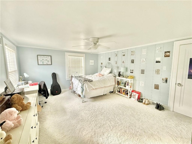 bedroom featuring ornamental molding, carpet, and ceiling fan