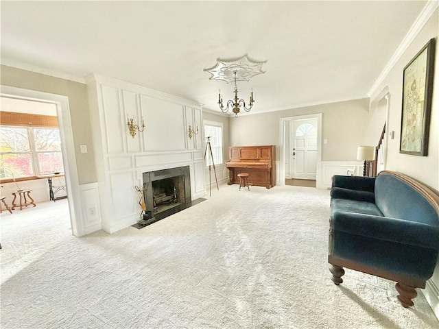 carpeted living room with crown molding and a fireplace