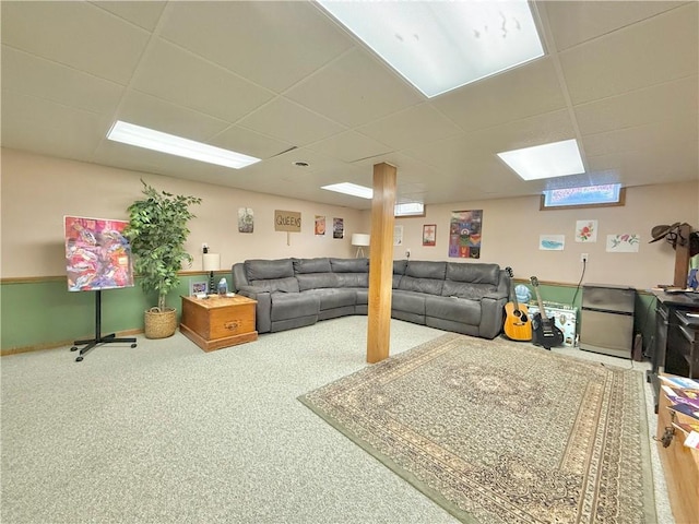 living room with a paneled ceiling