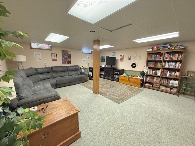 living room featuring a paneled ceiling