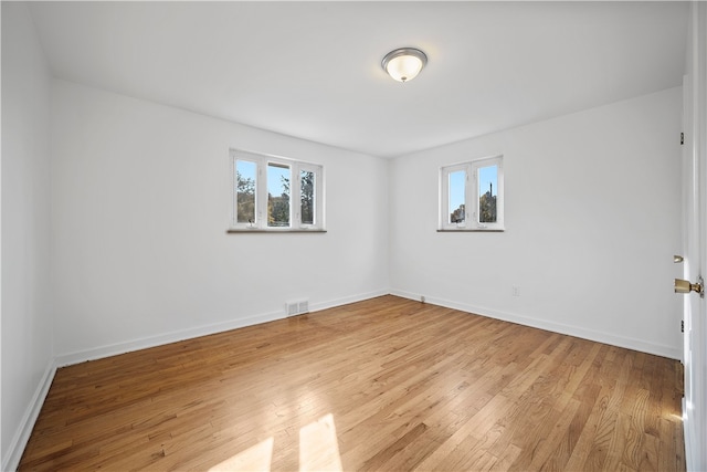 spare room featuring light wood-type flooring