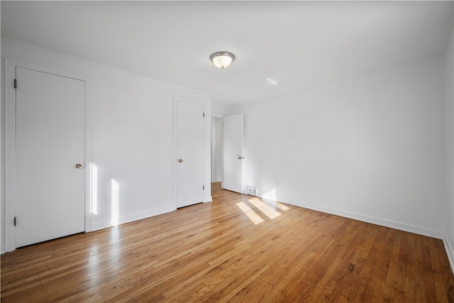 empty room with light wood-type flooring